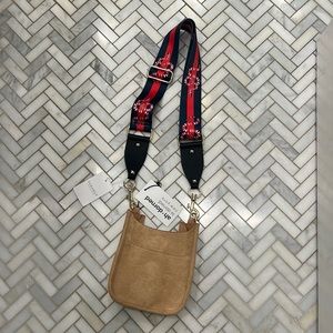 Ah-dorned camel, suede/or suede like, petite crossbody and removable strap.
